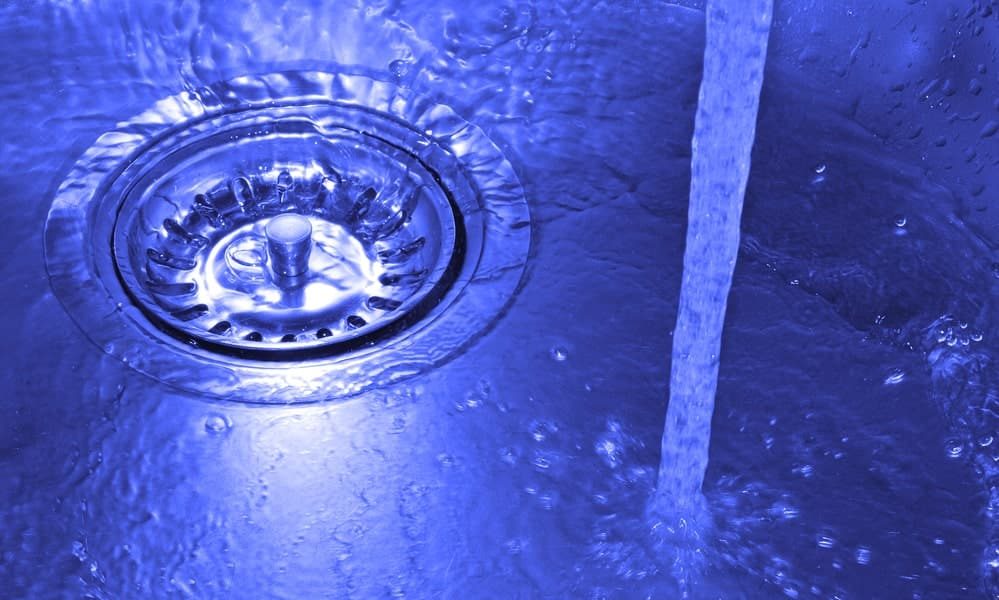 Drain cleaning services in Calgary Alberta represented by a sink with running water